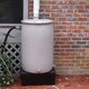 Rain barrel in front of house